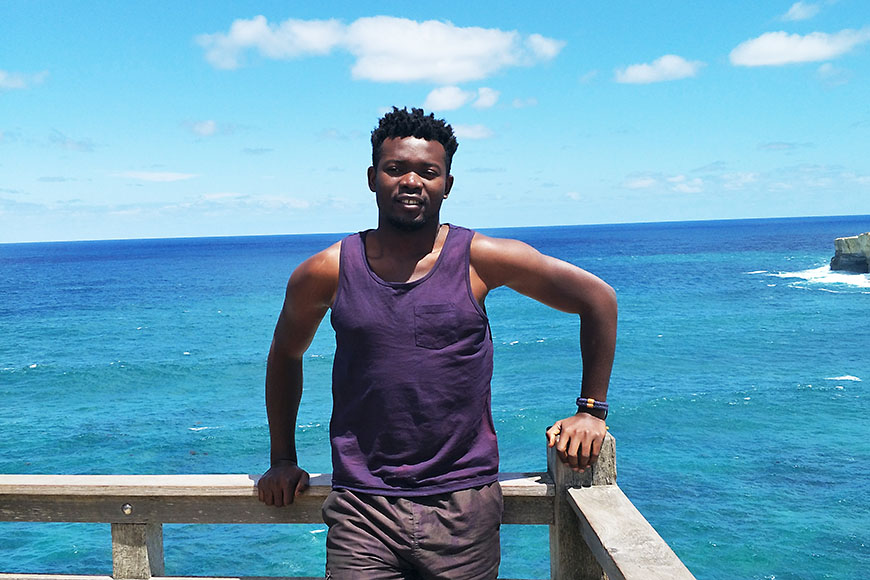 international student ambassador temitope with a view from the Great Ocean Road