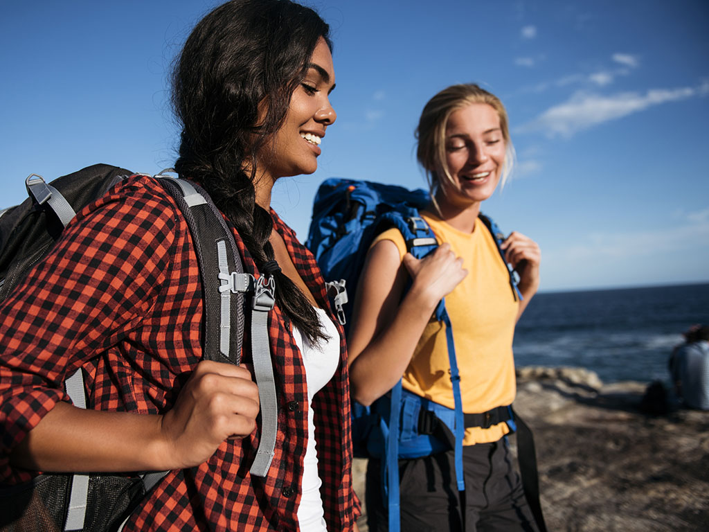 students with backpacks hiking