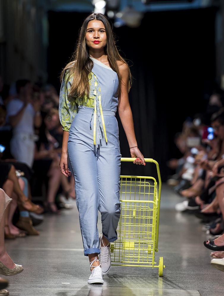 fashion model on runway with shopping trolley